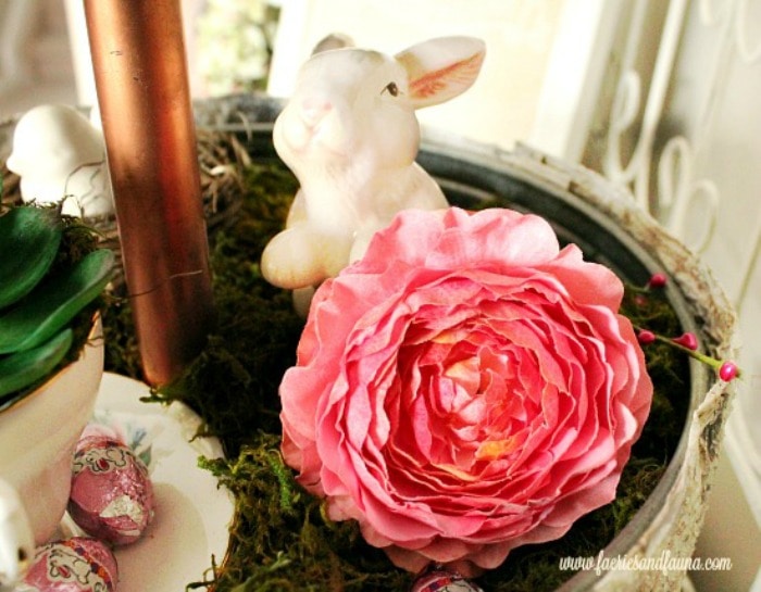 DIY Spring décor with a three tier tray, flowers and miniature bunnies. A bright and cheerful Spring display.