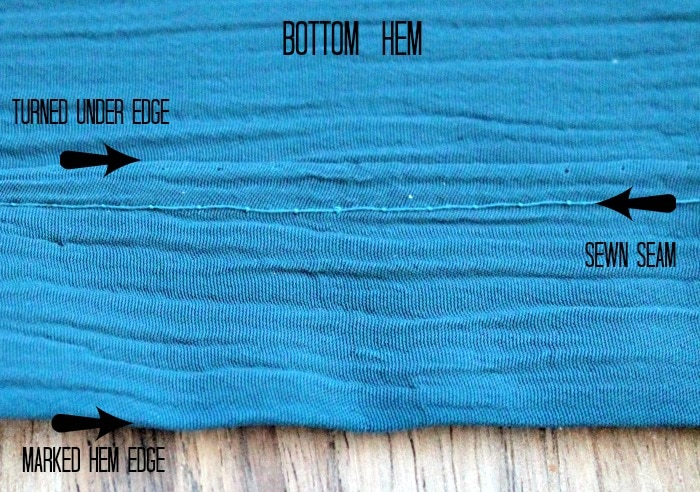 How to sew the bottom seam of a DIY curtain that adds a layer of colour to fall home decor.