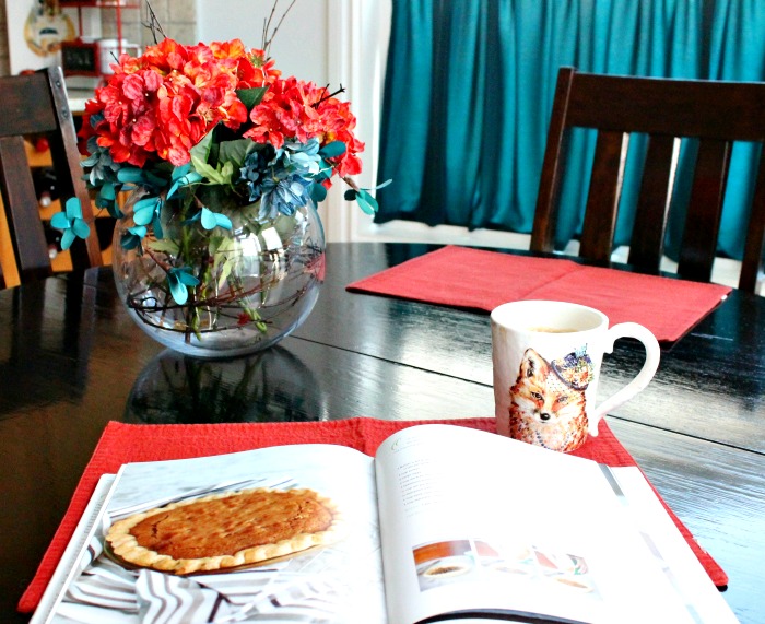 Kitchen table with fall decor, a fall centerpiece and a pumpkin pie recipe book. Fall Home Tour, fall decor ideas, DIY fall decorating, 