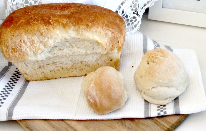 Home made bread on a wood cutting board for farmhouse decor. farmhouse kitchen, farmhouse style kitchen, farm style kitchen,farmhouse kitchen accessories