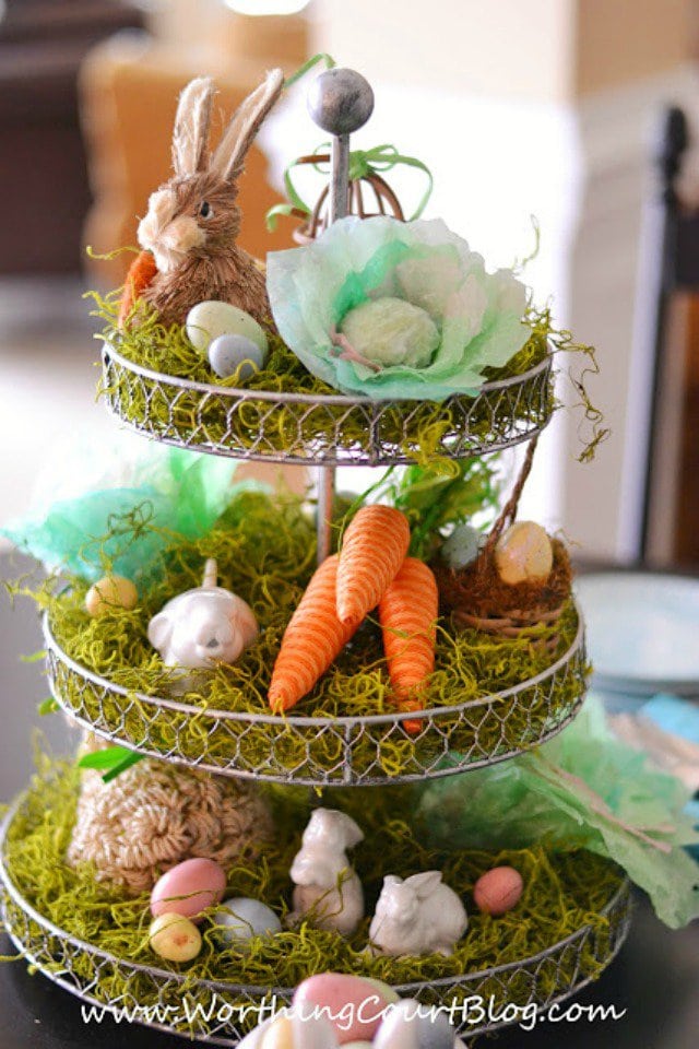 An Easter themed Spring themed tiered tray for decorating.  This one has rabbits, moss, carrots and Easter eggs