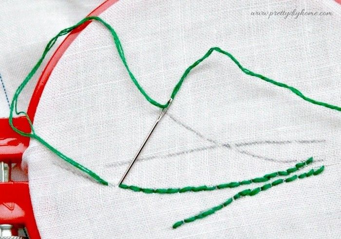 Sewing lavender stems using a back stitch in embroidery