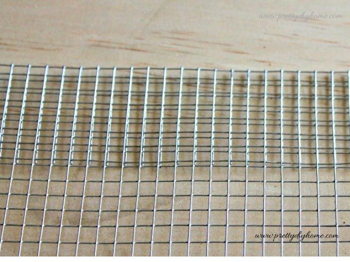 he top edge of the wire mesh is folded over to create a smooth, finished edge for the basket.