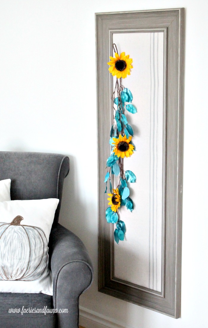 Full length decorative bulletin board using flowers.