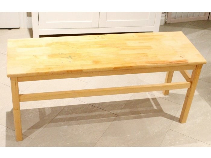 A plain but solid birch wood bench before image.