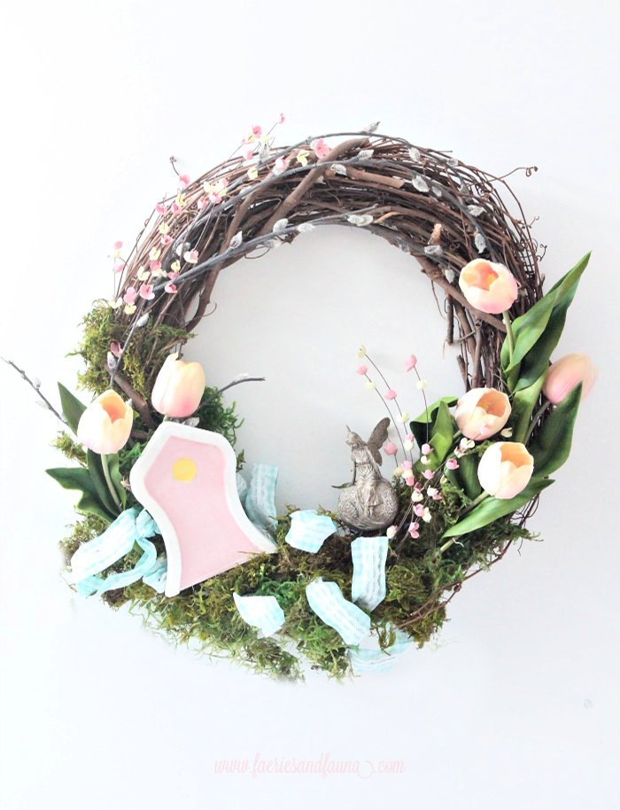 A colourful Spring wreath craft with a fairy garden.