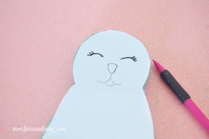 How to make a cut out bunny with a free pattern and tracing the face onto the wooden bunny diy.