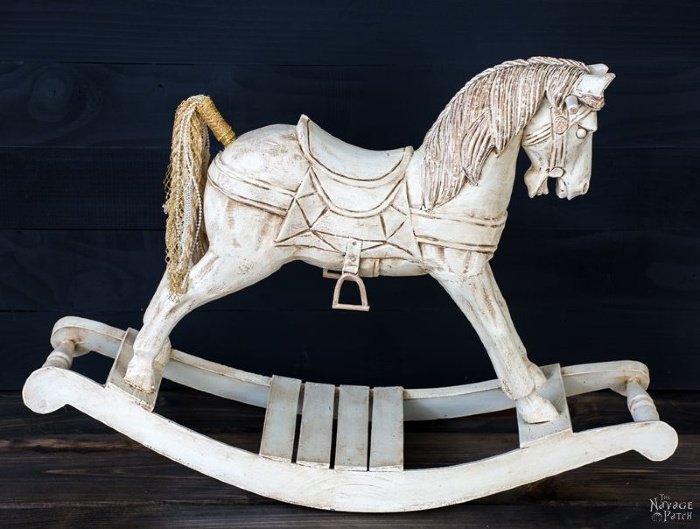 A vintage rocking horse thats been made over for Christmas decorating.   Christmas decorating vintage style with an old rocking horse.