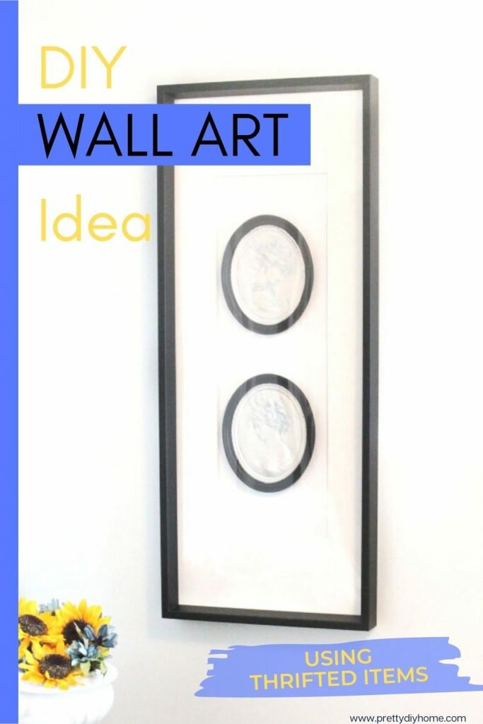 Large black and white wall art idea using two black and white painted cameos and a large IKEAframe
