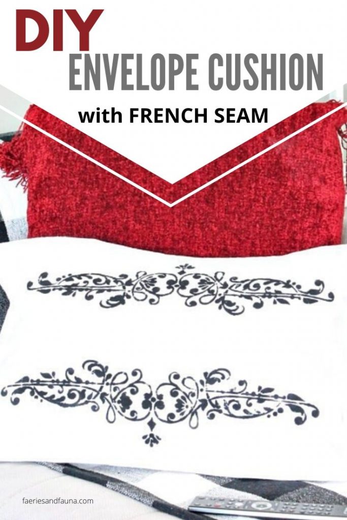 White Drop cloth and black stenciling create a dramatic french seamed cushion using drop cloth.