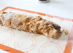 A roll of homemade pumpkin scone dough before cutting.