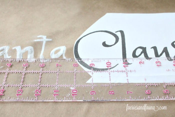 Lining up the letters for a Scroll sign craft