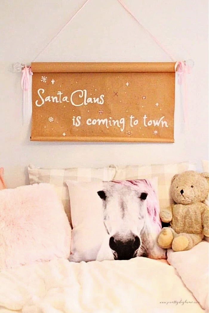 Santa Claus Is Coming to Town scroll sign styled in a girlish pink Christmas bedroom