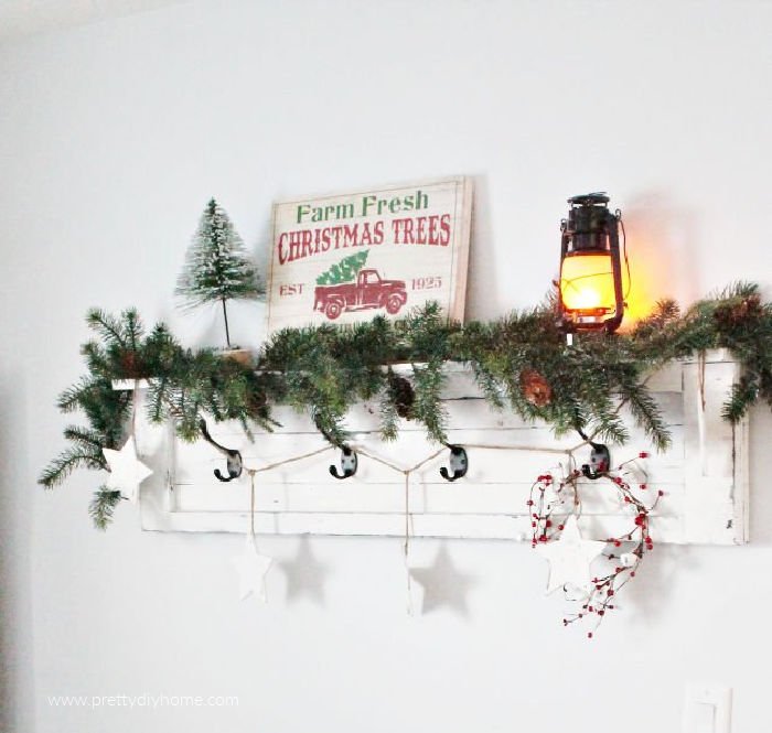 White farmhouse shelf decorated for Christmas