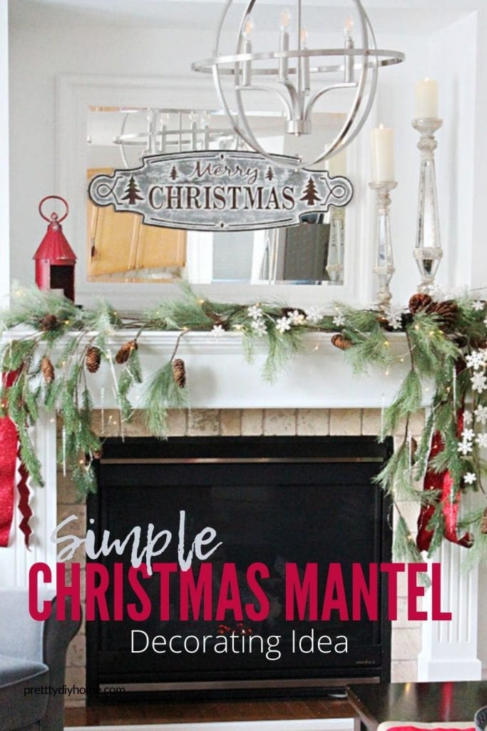 A simple traditional Christmas mantel with green tree boughts, red ribbon, and white snowflakes.