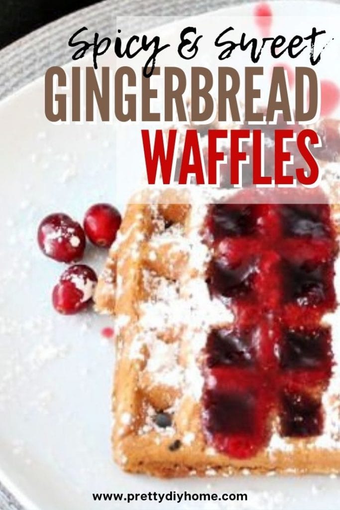 Christmas breaksfast golden gingerbread waffles with cranberry syrup and icing sugar topping.