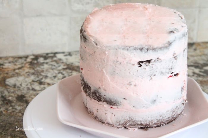 crumb coat on a chocolate strawberry cake for Valentines dessert.