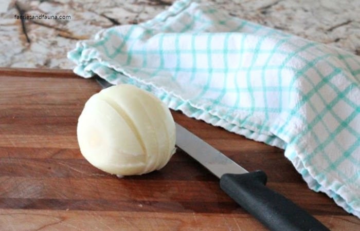 Slicing onions for french onion soup.