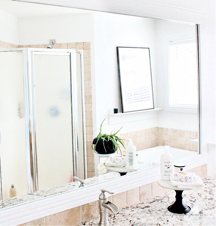 DIY backsplash tiling in a bathroom.  