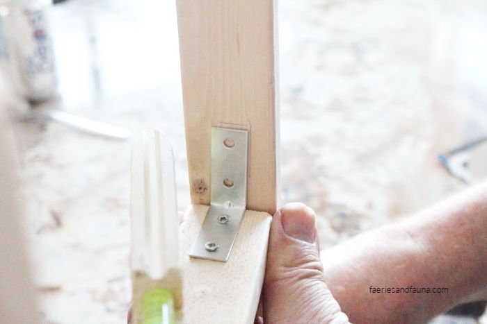 https://prettydiyhome.com/wp-content/uploads/2020/04/Building-a-diy-small-ladder-for-tea-towels.jpg