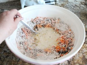 Mixing healthy bran muffins batter for old fashioned bran muffins made with All Bran cereal.