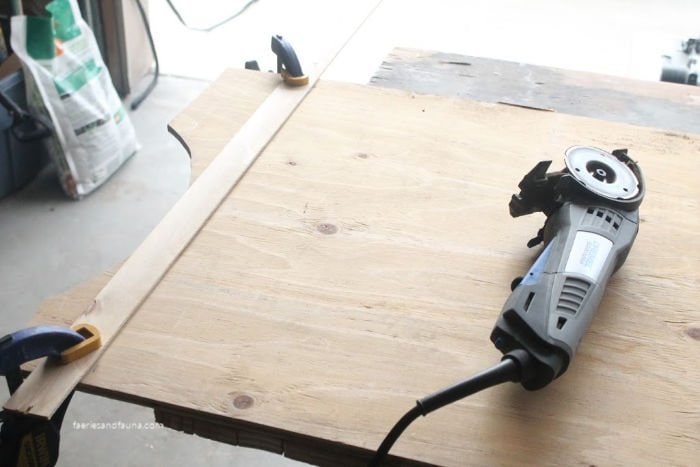 Cutting plywood to make a faux farmhouse door.