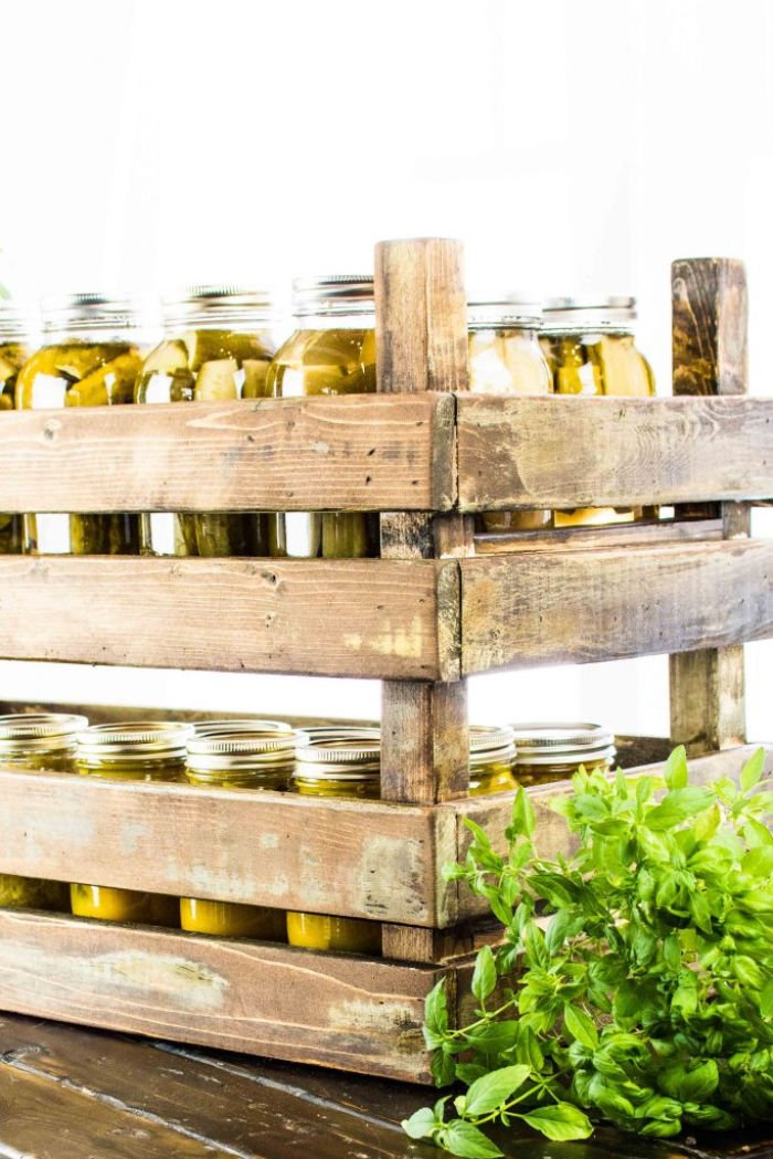 DIY stackable crates holding jars for farmhouse storage.