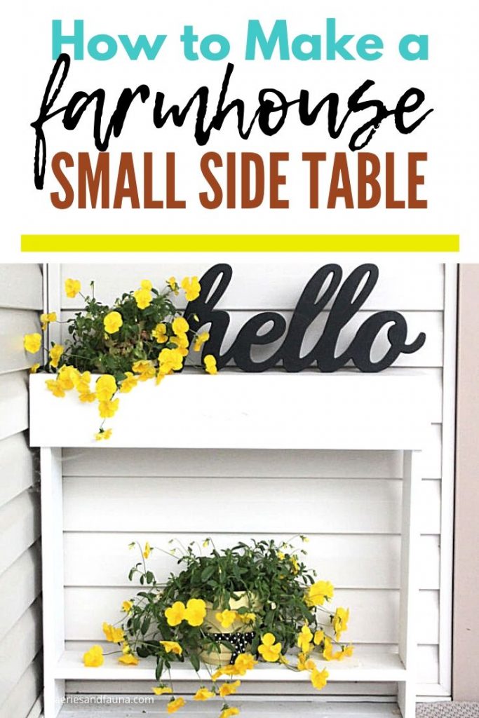 A white painted handmade side table with yellow pansies, and flower pots.