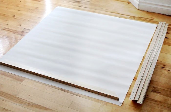 A large canvas print from Photowall, laying on a flat surface with the frame before assembly. Some wrinkles are showing as the canvas print has not been stretched.