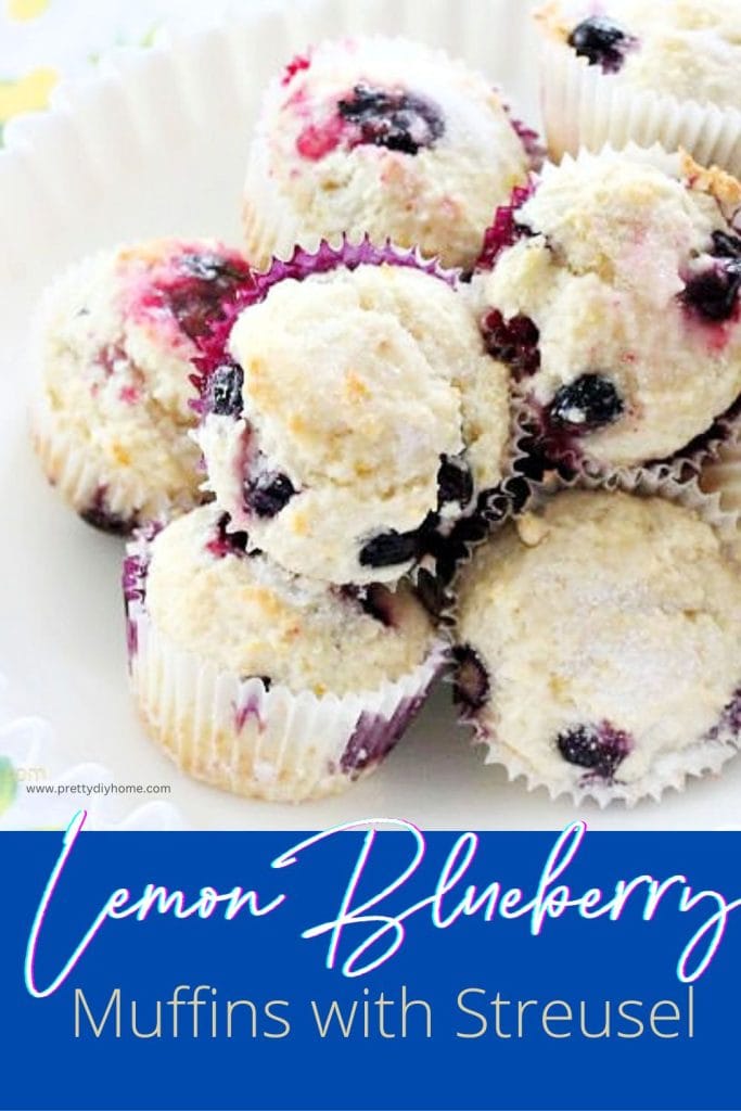A large pile of lemon blueberry muffins with sugary streusel topping all piled inside a large white milk glass bowl.