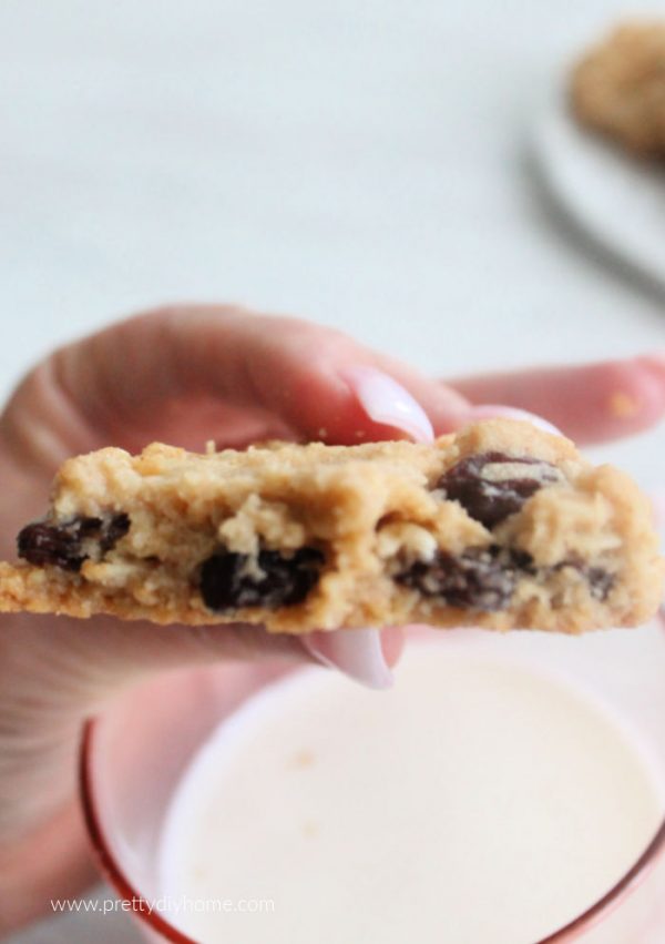 Homemade Oatmeal Raisin Cookies with Peanut Butter Half an oatmeal raisin & peanut butter cookie showing the center of the cookie