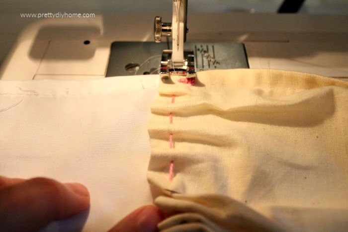 Sewing even folds on a fill using a sewing machine while making a DIY farmhouse shower curtain.