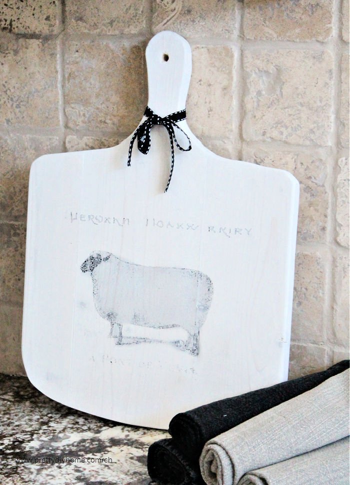 DIY Cutting board in white with a french farmhouse graphic sheep on the front.