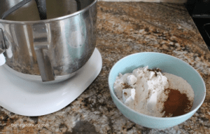 Mixing flour, and spices in a small bowl for adding to tomato soup cake recipe