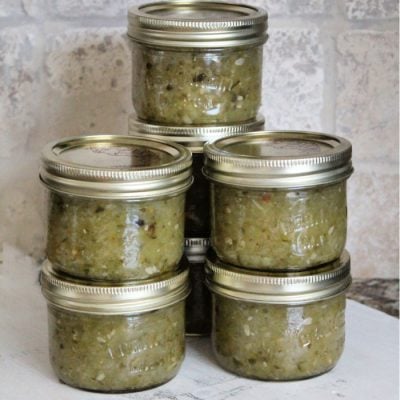 A batch of homemade sweet pickle relish hot pack canned into half pint jars.