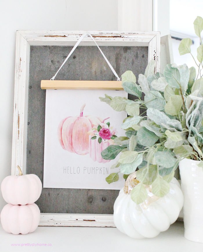 A farmhouse DIY pink pumpkin printable with pink and white pumpkins and greenery for Fall.