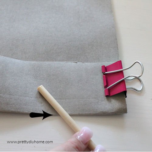 Folding and pressure creasing kraft tex washable paper for making a DIY cushion cover.