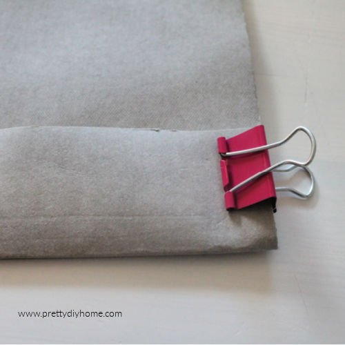 Folding washable paper over and holding in place with an alligator clip