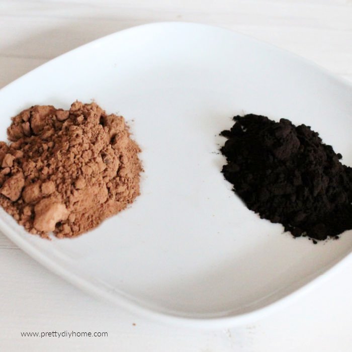 Regular cocoa and black cocoa on a plate to show the difference in colour