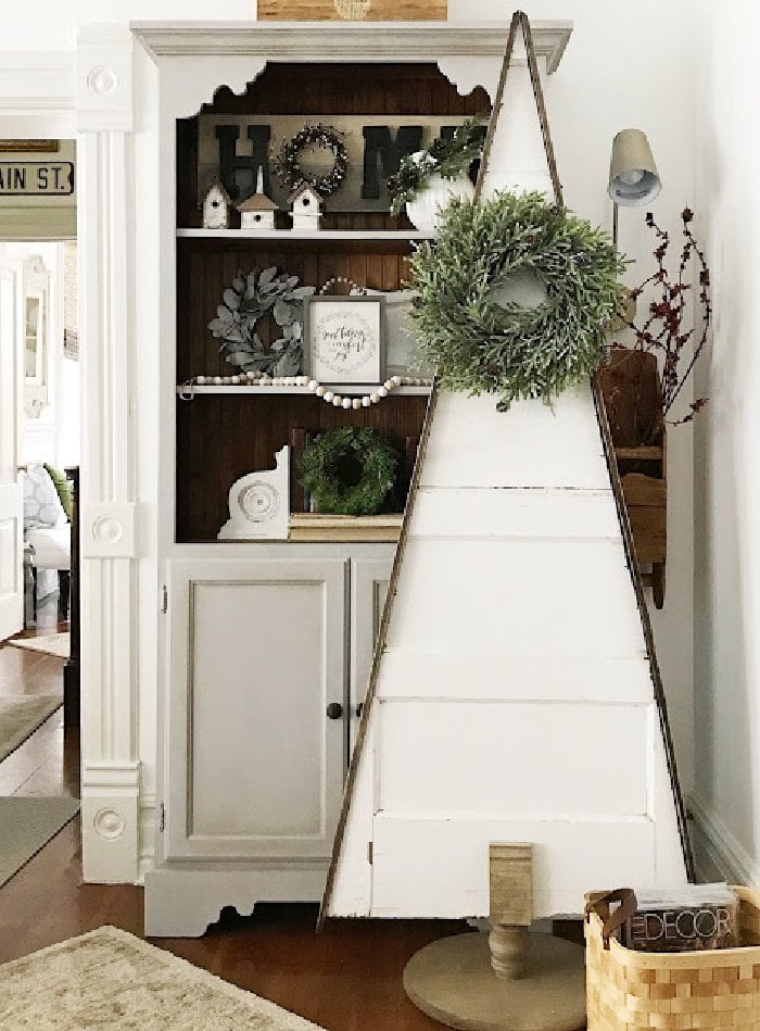 An old door made into a Christmas tree for Farmhouse Christmas decor idea