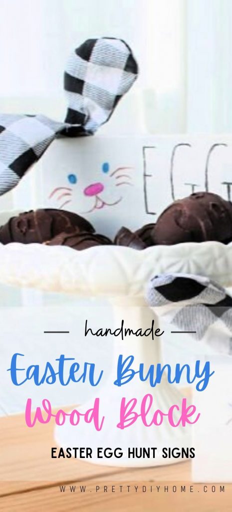 Cute wood block bunnies with buffalo plaid ears, Sitting in a dish of chocolate Easter eggs. The image text says handmade Easter Bunny Easter Egg Hunt Signs