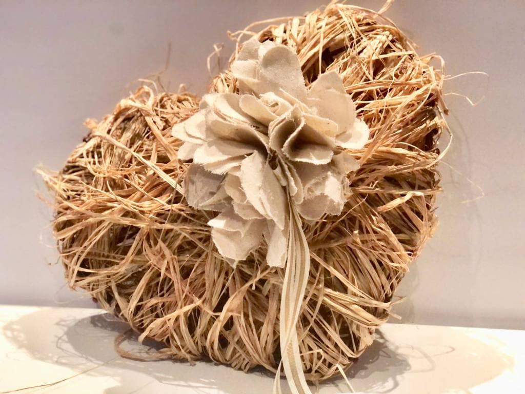 A cream raffia covered Valentine in a shabby chic style.