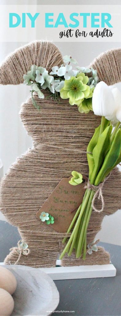 A twine covered Easter bunny with floral crown and faux tulips. An easy to make DIY Easter gift idea as their is a card that says Some Bunny Loves You.