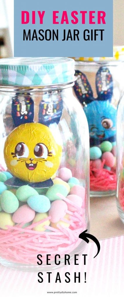 A DIY Easter mason jar gift idea with a checkered lid, bright pink Easter grass, colourful chocolate eggs and a Easter bunny. There is a money folded insider that you cannot see in the picture.