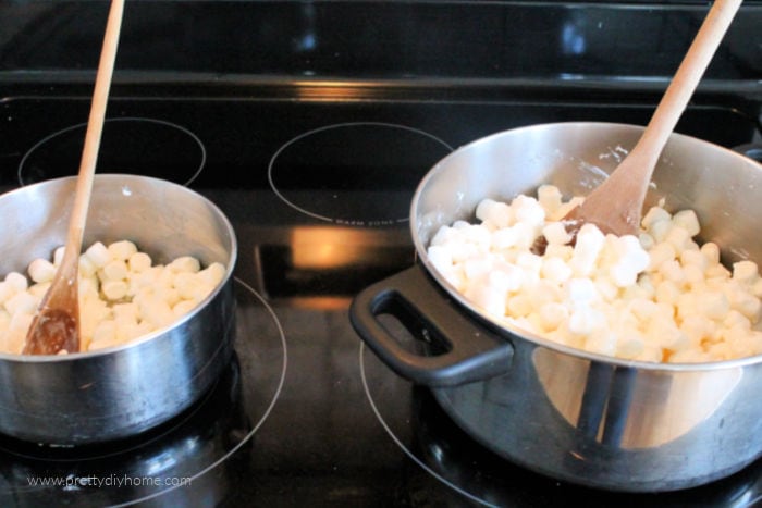 Two pans with melted butter and marshmallows being stirred to coat.