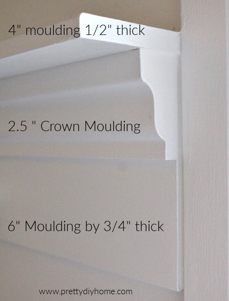 Closeup of edge of DIY wood shelf, showing the three different types of white moulding needed.