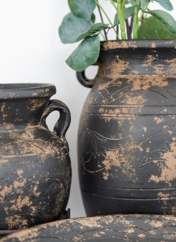 Two large mud painted vases in dark brown and beige.