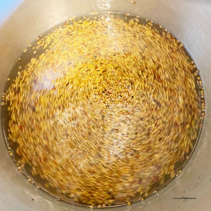 A large pot full of bread and butter pickle brine.