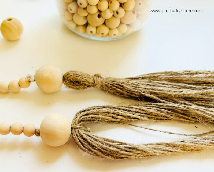 Tassles being made on the end of a farmhouse bead string.