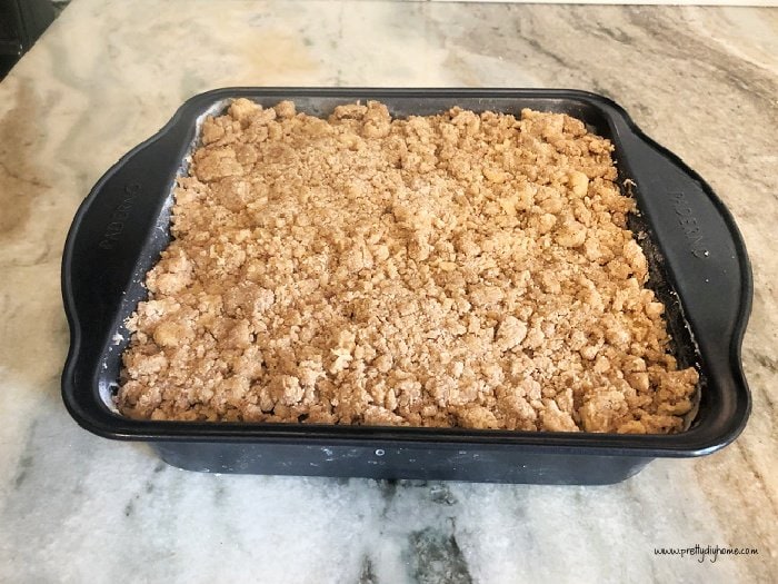 How to Make Pumpkin Spice Cake 



Preheat the oven to 350.  Grease a square 8 inch pan.  Line the bottom with parchment paper.



We will start by mixing together each layer of the pumpkin dessert, then put it all together at the end before placing it in the oven.  This is a great recipe with layers that bake all together.



Step 1 - Mixing Pumpkin Cake Batter



In a large bowl, combine the wet ingredients, pumpkin, egg, sugar, oil, and vanilla in a mixing bowl.



In a second bowl stir together the dry ingredients, flour, salt, soda, baking powder, and spices.  



Set aside.  



Step 2  - Cream Cheese Layer



In a medium bowl with the paddle attachment, mix the cream cheese, and white sugar, and beat until creamy.  Add the vanilla extract, mix again, and set aside.



Step 3 -Mixing Streusel Layer



In a separate bowl mix the butter with the two sugars until blended.  Add the flour, then add the baking powder and spices to the flour mixture.  



Mix until the crumbs are the size of small peas.  Set aside. 



Step 4 - Assembling the Pumpkin Cake Layers



This pumpkin is a bit different than other sheet cakes, the layers are all placed onto the cake sheet and baked at once.  For the pumpkin cake bottom layer, mix the dry ingredients into the pumpkin mixture.  Mix until just combined and transfer the wet batter to the 8 by 8-inch prepared pan. Spread evenly.



For the middle cream cheese frosting layer. Place spoonfuls of the cream cheese mixture over the pumpkin batter. 



Lightly spread the cream cheese over the pumpkin batter in a thin layer, making sure not to combine the layers into a swirl.



Place the streusel crumbs evenly over the top and place in the oven.



Bake at 350 for 40-45 min  Let cool before slicing.